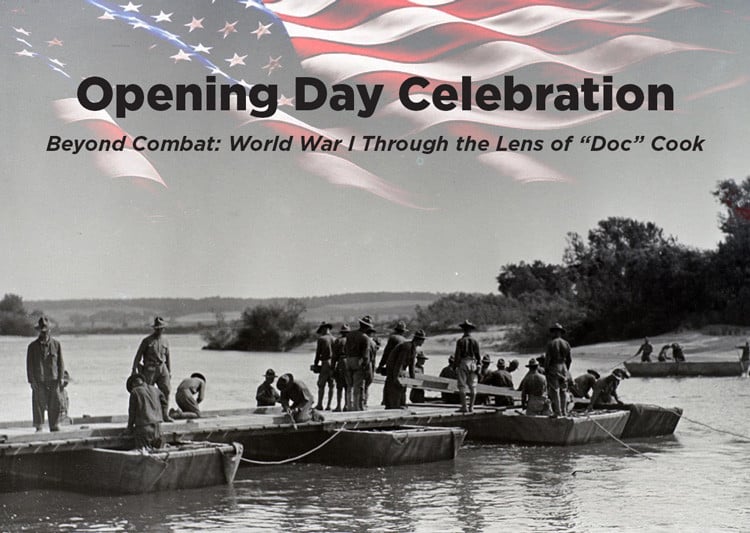 A black and white image of about two dozen World War I soldiers that appear to be constructing a wooden bridge across a body of water. A color image of an American flag is across the top of the image, in addition to the exhibit name.