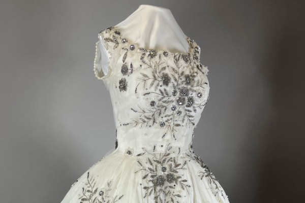 Photo of a white sleeveless dress with elaborate floral beading